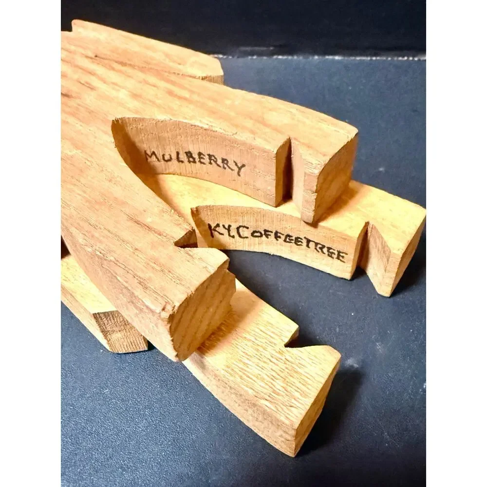 Wooden Stacking Dudes interlocking human shaped made of multiple woods